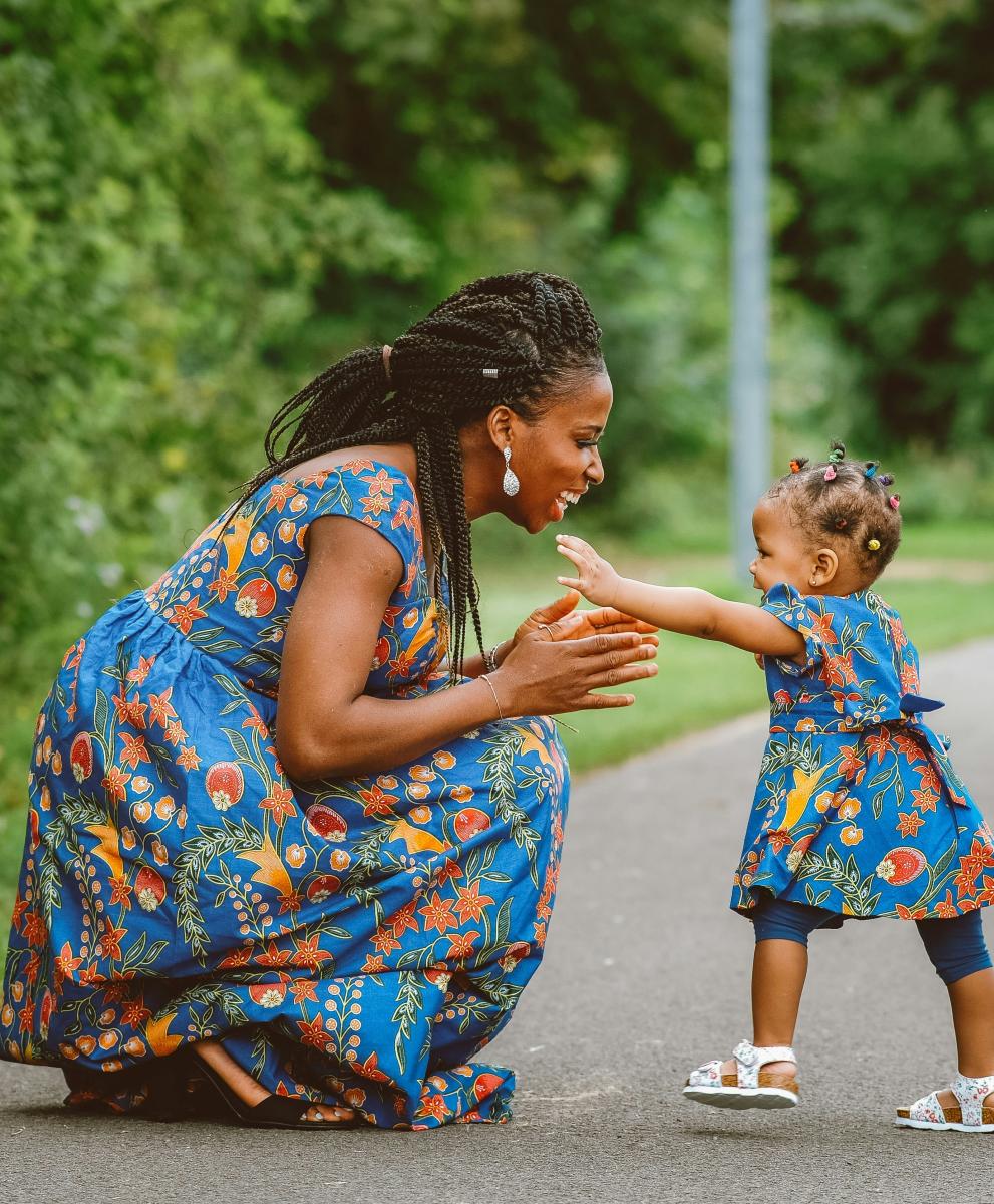 woman and child smiling at each other.