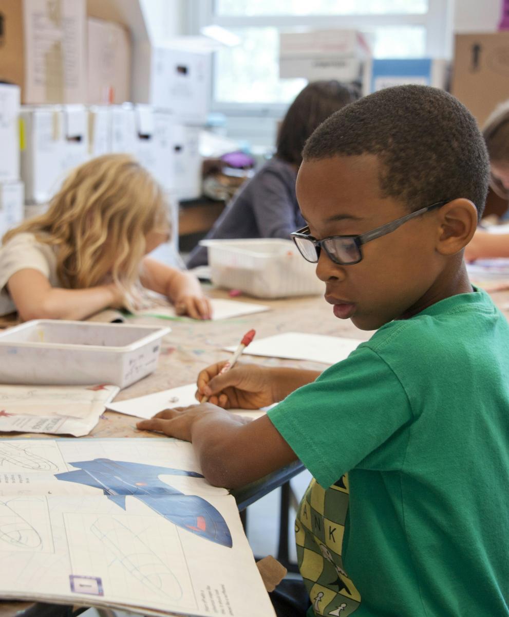 Children working on classroom work.