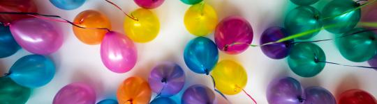 An image of balloons symbolizing celebration and achieving a milestone.