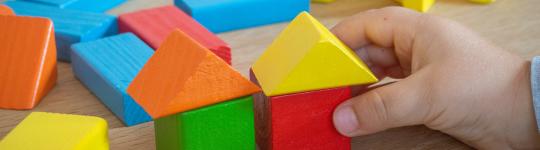 Image of building blocks. Represent building together/partnership. 